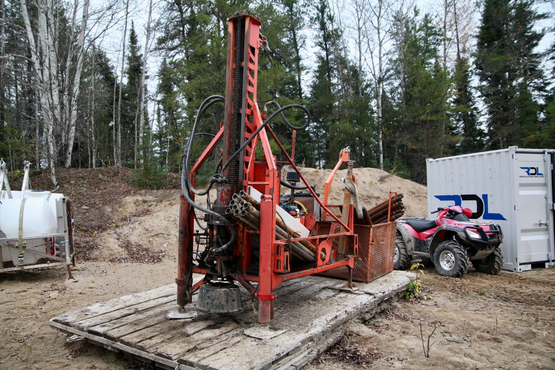 Heli-portable drill staged on a remote tower pad